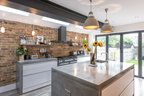 grey polished concrete worktop in industrial-style London kitchen