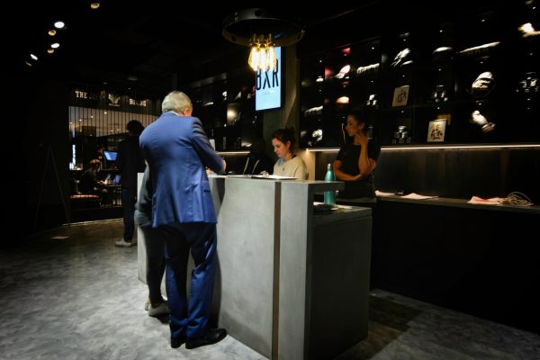 Concrete reception desk in use at BXR gym in Marylebone