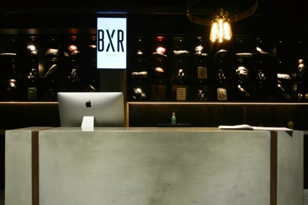 Large bespoke concrete reception desk at BXR Marylebone