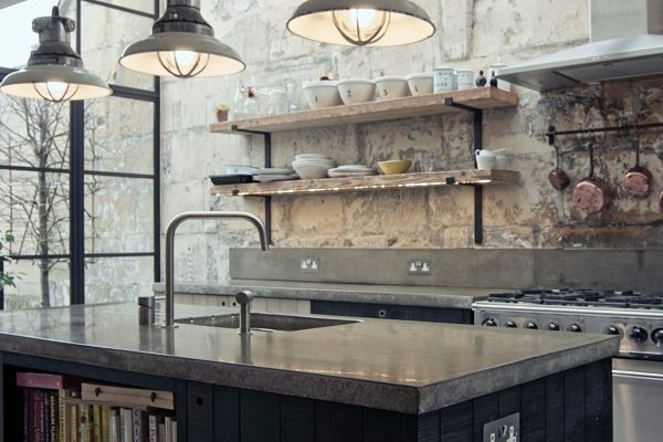 Portland grey concrete worktops with timber kitchen cabinetry