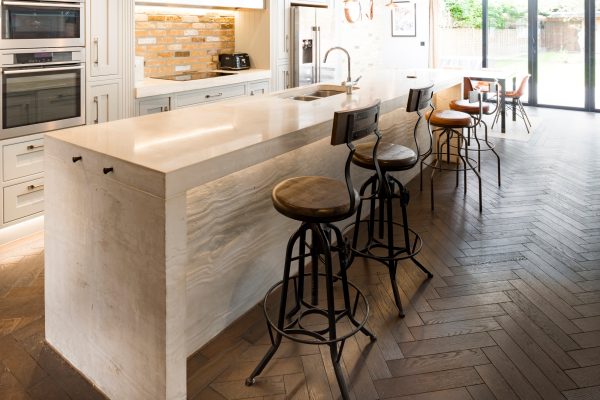 board-formed concrete kitchen worktop with timber textured front panel