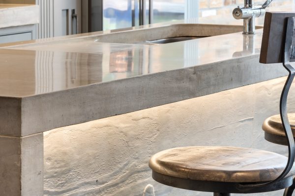Close-up of textured board-formed concrete kitchen worktop