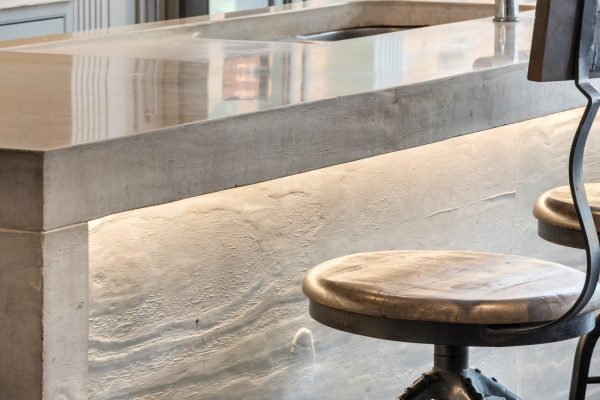 Board-marked concrete worktop edge with pronounced timber grain