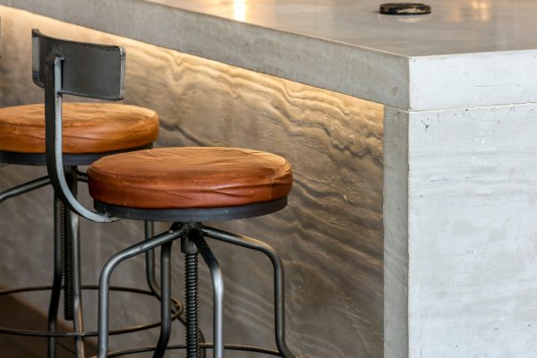 board marked concrete island with waterfall ends