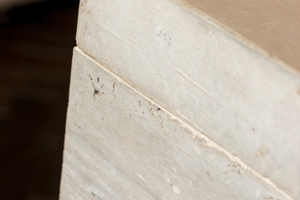 close up of joint detail on timber textured concrete