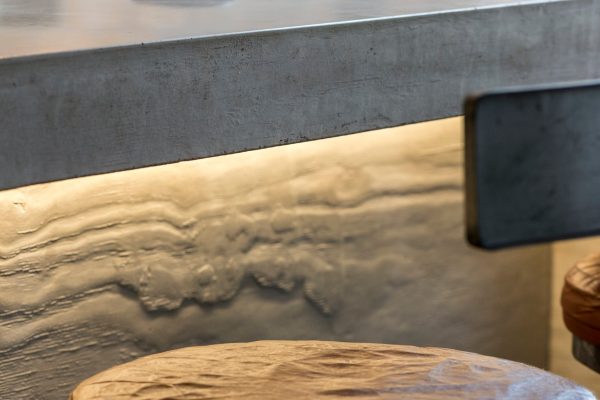 rustic edge detail on board marked concrete worktops