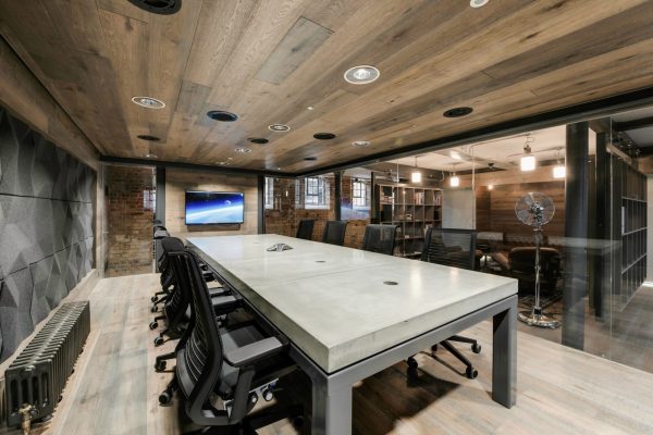 Large polished concrete meeting table with 70mm thick slabs