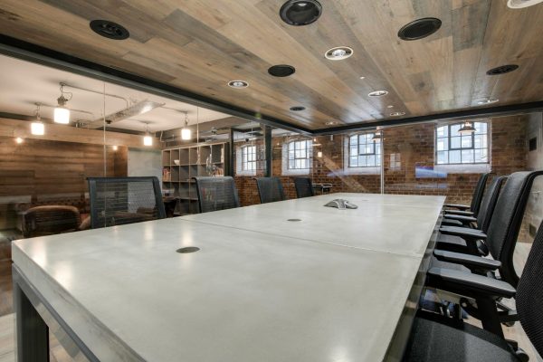 Bespoke concrete meeting table with shadow gap detailing